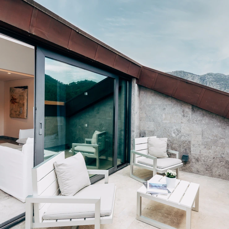 Attic Suite with terrace at D Resort Gocek with canopy bed and bright decor
