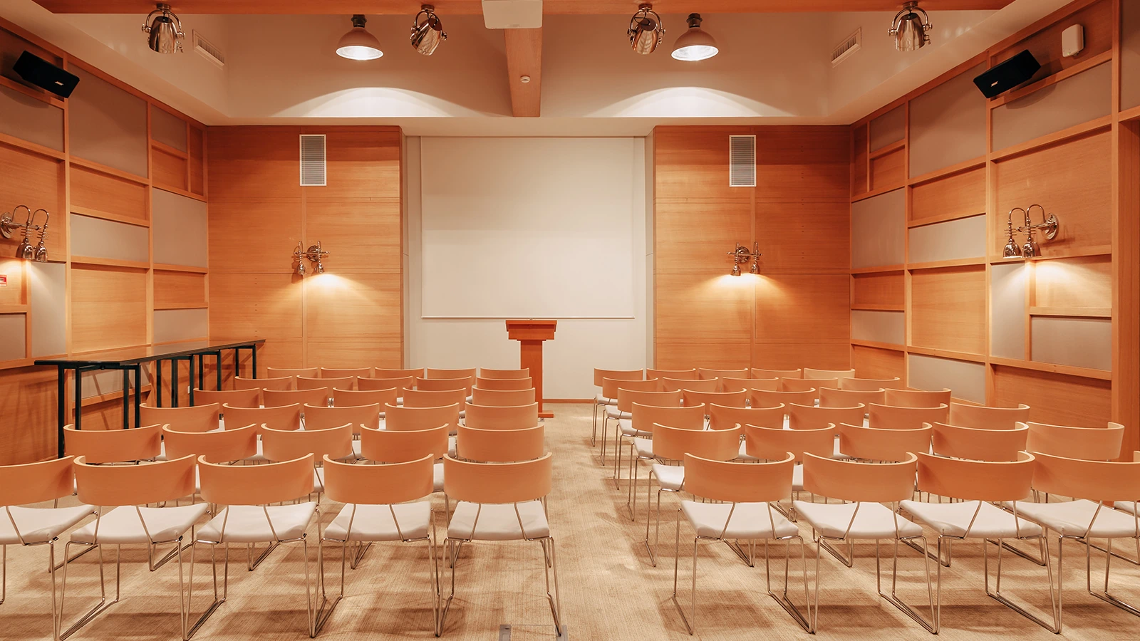 Meeting room at D Resort Gocek with wood paneling and theatre seating